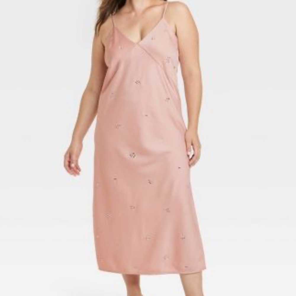 Pink slip dress with a slit down the side, diamonds on it